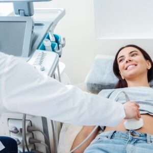 Woman smiling while having ultrasound