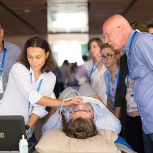 team surrounding ultrasound procedure