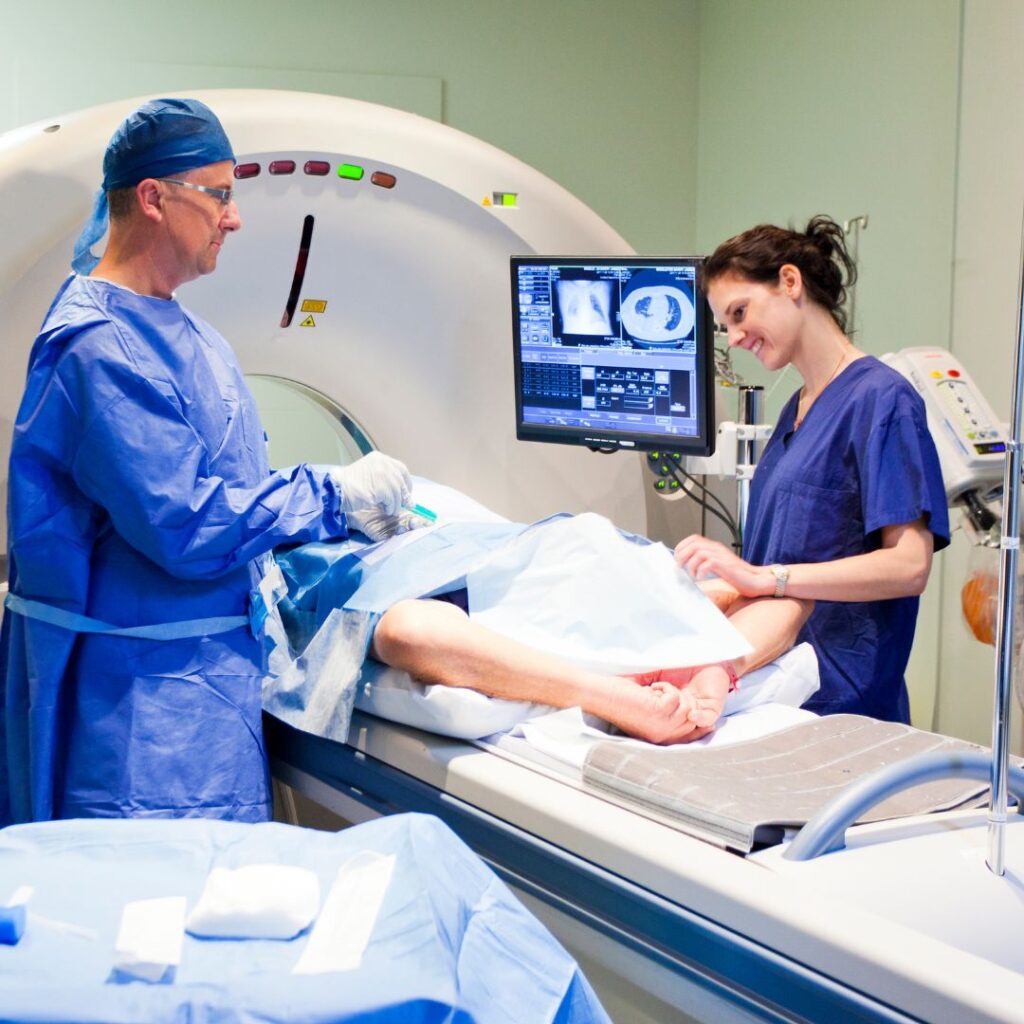 MRI tech working with patient and doctor