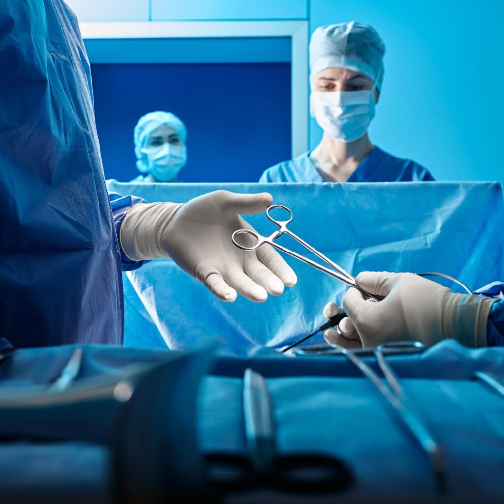 a surgeon tech handing over tools