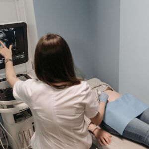 A nurse looking at an ultrasound