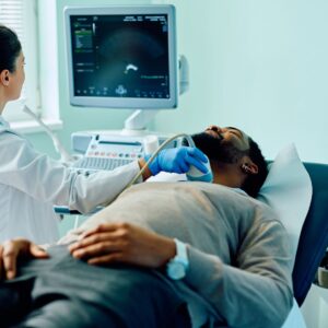 A nurse completing a throat ultrasound
