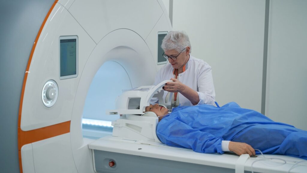 a MRI tech setting up an MRI machine